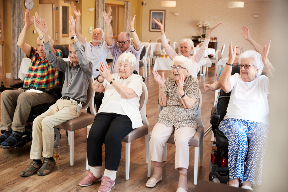 Residents cheering during a group activity